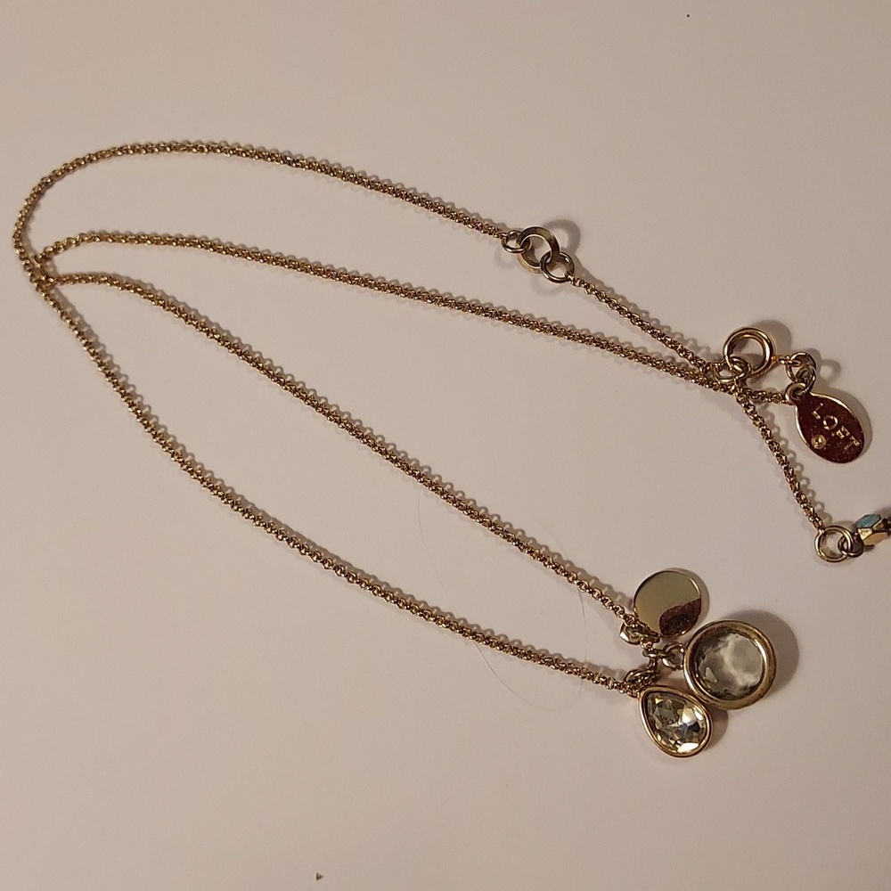 Loft necklace gold tone  with triple charms charm necklace